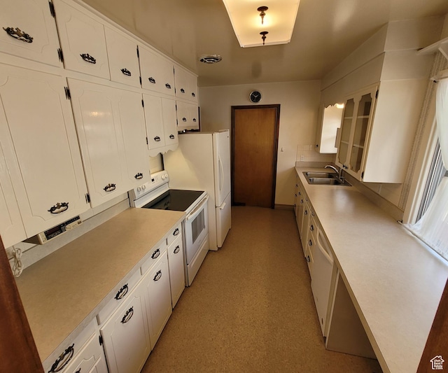 273 S 7th St S, Montpelier, ID 83254 - kitchen featuring white appliances, white cabinetry, and light countertops