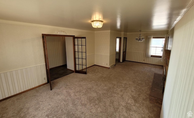 273 S 7th St S, Montpelier, ID 83254 - carpeted spare room featuring a chandelier, ornamental molding, and a wainscoted wall