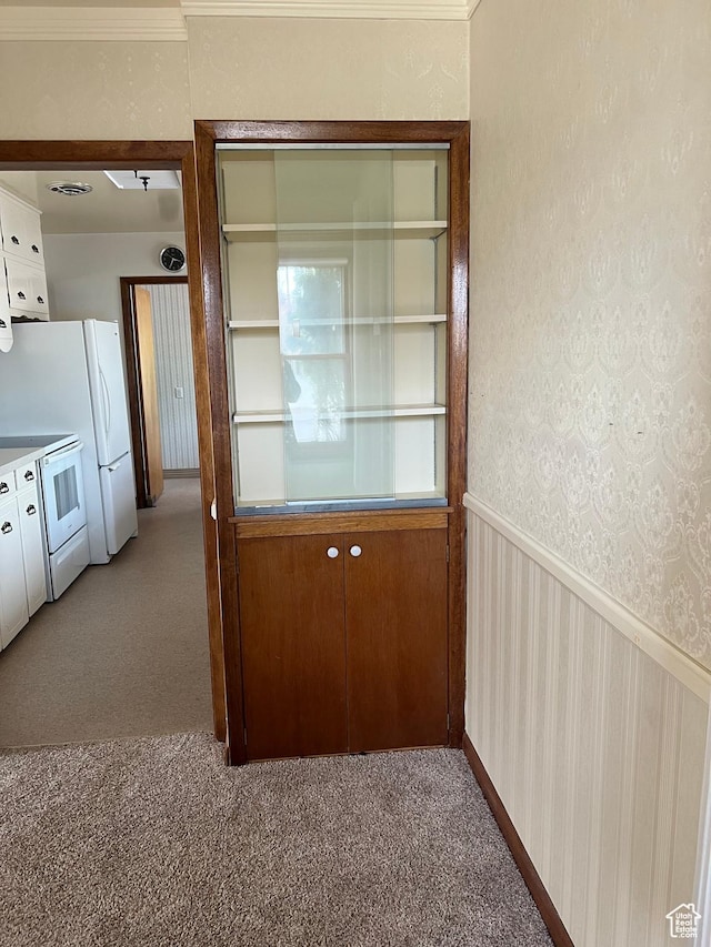 273 S 7th St S, Montpelier, ID 83254 - unfurnished dining area featuring carpet flooring and wainscoting