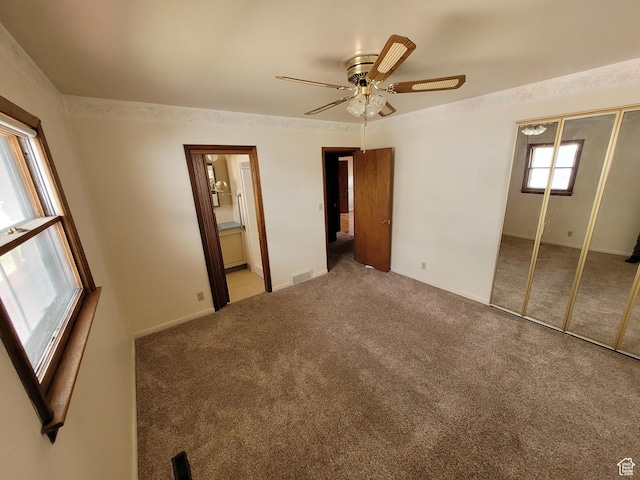 273 S 7th St S, Montpelier, ID 83254 - unfurnished bedroom featuring carpet flooring, a closet, ceiling fan, and ensuite bath