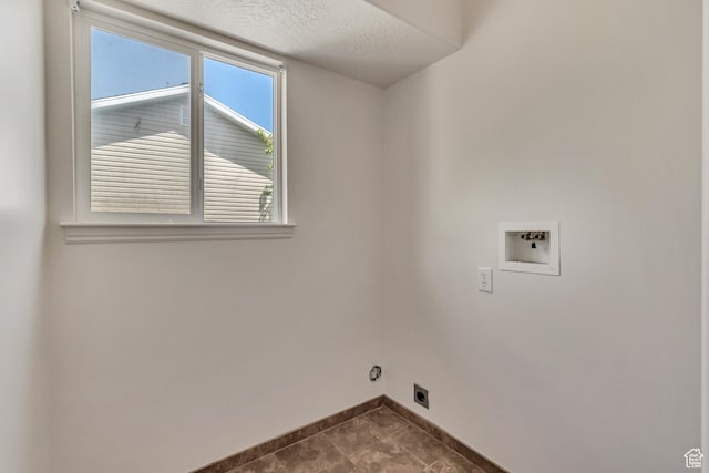 6706 S Adventure Way, West Jordan, UT 84084 - laundry room with laundry area, washer hookup, dark tile patterned flooring, hookup for an electric dryer, and baseboards