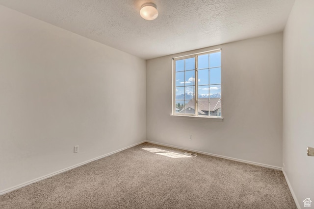 6706 S Adventure Way, West Jordan, UT 84084 - unfurnished room featuring carpet floors, a textured ceiling, and baseboards