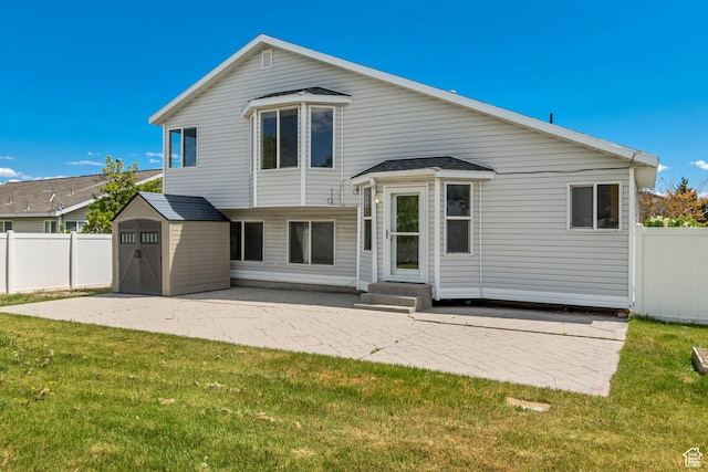 6706 S Adventure Way, West Jordan, UT 84084 - back of house with a yard, a patio area, fence, and a shed