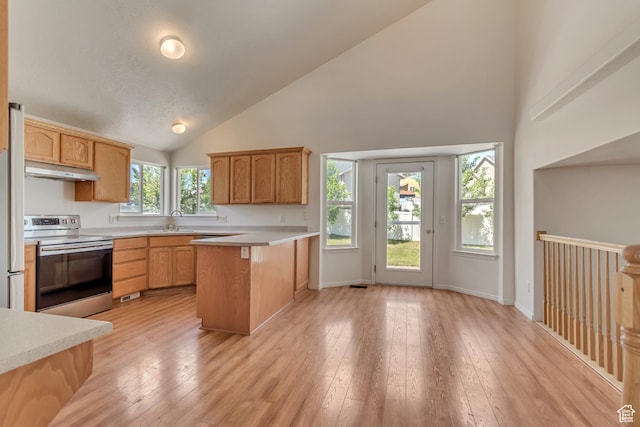 6706 S Adventure Way, West Jordan, UT 84084 - kitchen with a peninsula, high vaulted ceiling, stainless steel electric stove, under cabinet range hood, and light countertops