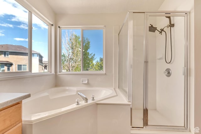 6706 S Adventure Way, West Jordan, UT 84084 - full bathroom featuring vanity, a garden tub, and a shower stall