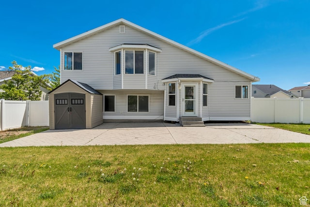 6706 S Adventure Way, West Jordan, UT 84084 - tri-level home featuring a front lawn, a patio area, a storage shed, and entry steps