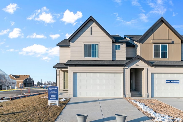 view of front of property with driveway and a garage