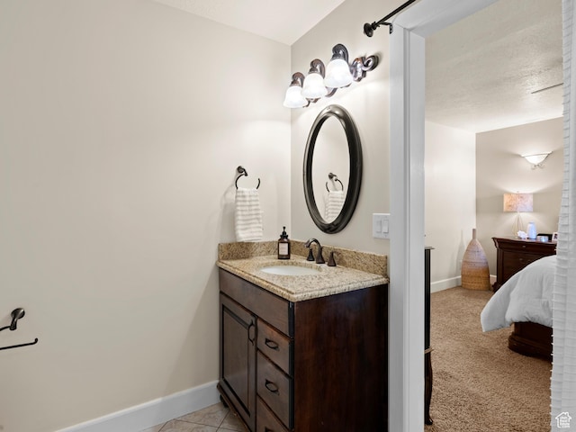 bathroom with baseboards and vanity