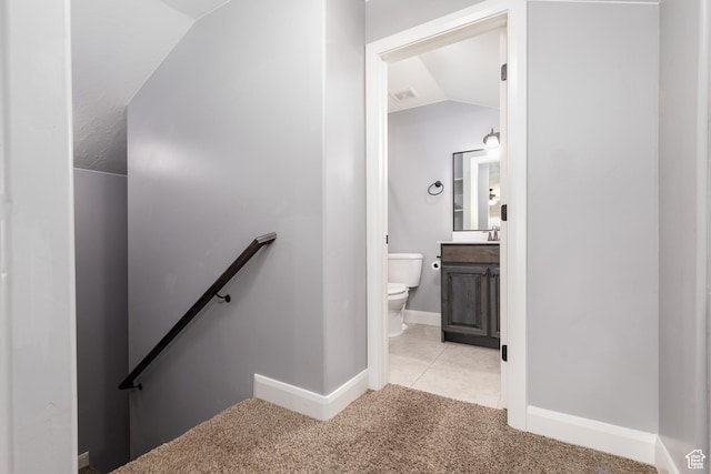 2562 S 4010 W, Hurricane, UT 84737 - stairs with lofted ceiling, tile patterned flooring, visible vents, baseboards, and carpet flooring