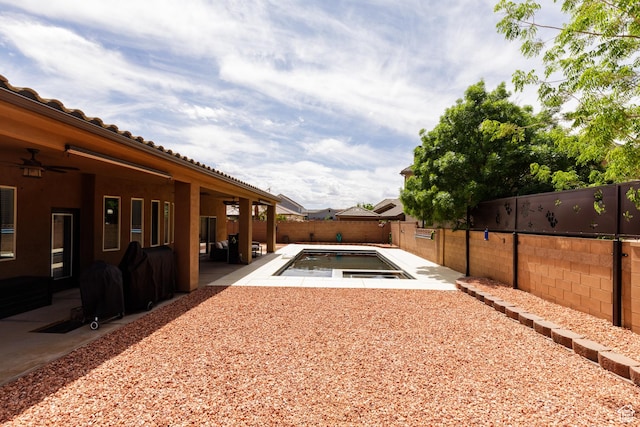 2562 S 4010 W, Hurricane, UT 84737 - view of yard featuring a patio area, a fenced in pool, a fenced backyard, and ceiling fan