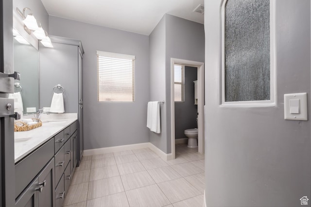 2562 S 4010 W, Hurricane, UT 84737 - full bath featuring tile patterned floors, double vanity, toilet, a sink, and baseboards