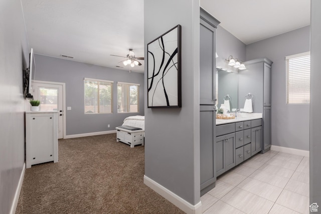2562 S 4010 W, Hurricane, UT 84737 - bathroom featuring vanity, baseboards, ceiling fan, and visible vents