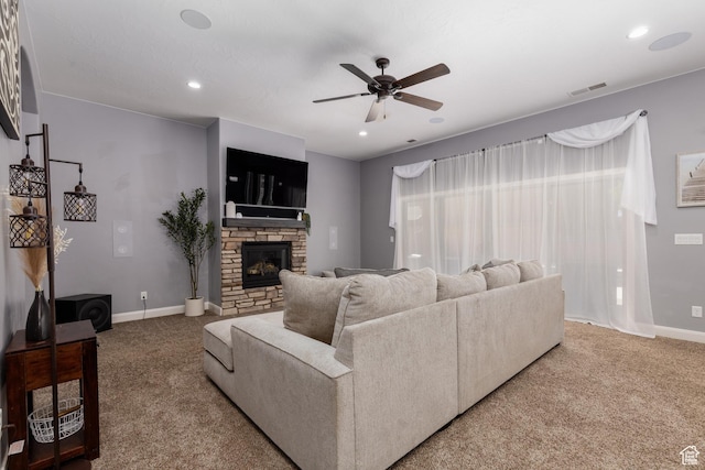 2562 S 4010 W, Hurricane, UT 84737 - living room featuring carpet, visible vents, a stone fireplace, and ceiling fan