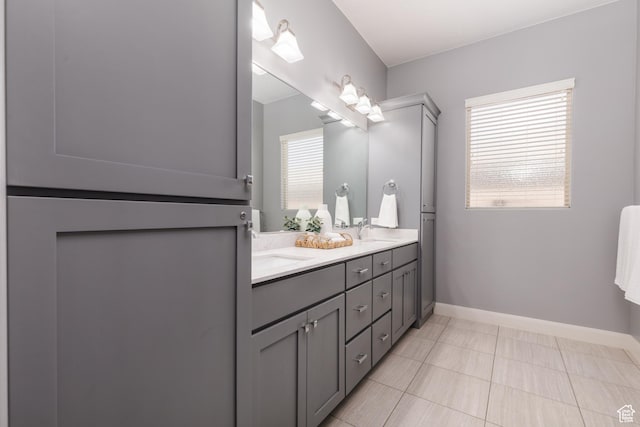 2562 S 4010 W, Hurricane, UT 84737 - bathroom with baseboards, tile patterned flooring, a sink, and double vanity
