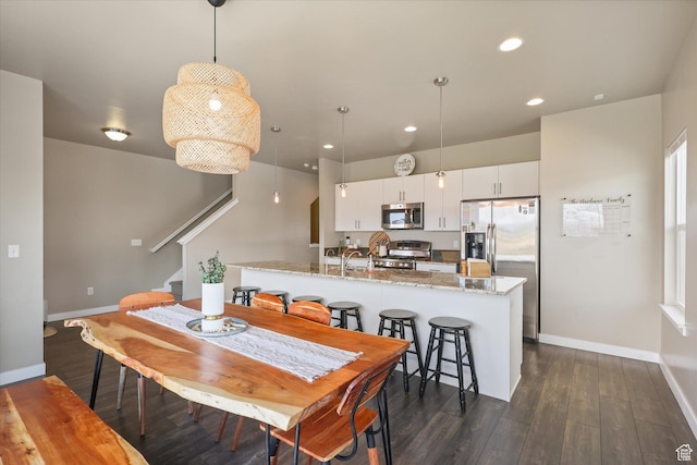 111 S 1800 W, Pleasant Grove, UT 84062 - dining space featuring recessed lighting, dark wood finished floors, baseboards, and stairs