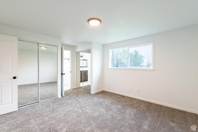 2389 S 4300 W, Taylor, UT 84401 - unfurnished bedroom with baseboards, carpet, and visible vents