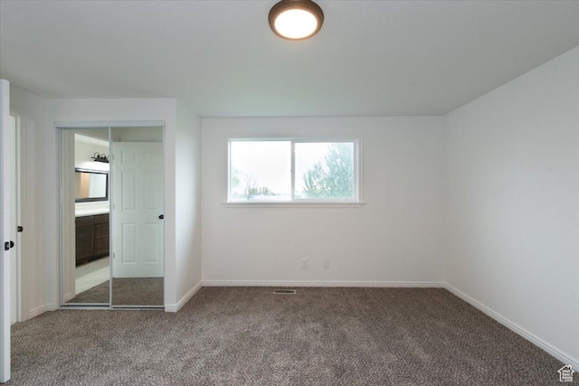 2389 S 4300 W, Taylor, UT 84401 - unfurnished bedroom featuring baseboards, carpet flooring, and visible vents