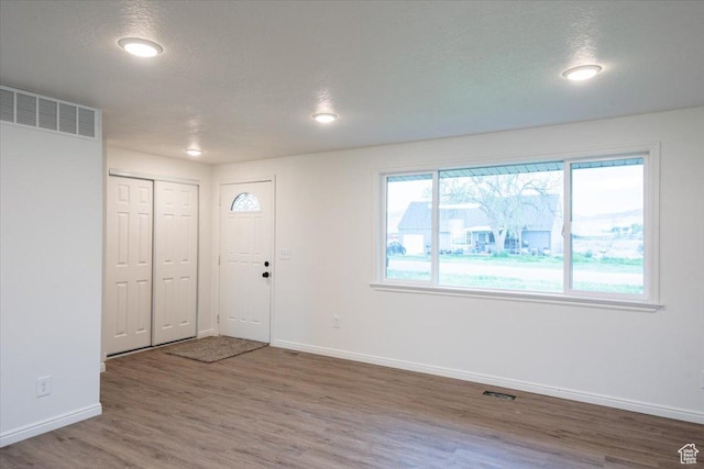 2389 S 4300 W, Taylor, UT 84401 - foyer entrance featuring a textured ceiling, visible vents, wood finished floors, baseboards, and recessed lighting