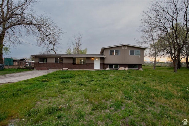 2389 S 4300 W, Taylor, UT 84401 - tri-level home featuring a front lawn