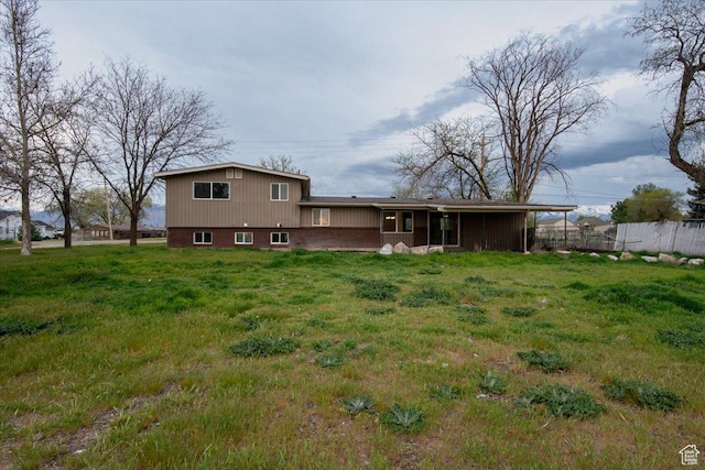 2389 S 4300 W, Taylor, UT 84401 - rear view of property featuring a lawn