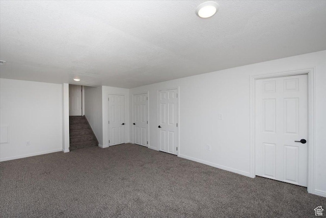 2389 S 4300 W, Taylor, UT 84401 - basement featuring stairway, baseboards, carpet flooring, and a textured ceiling