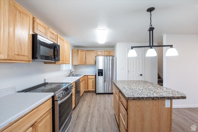 2389 S 4300 W, Taylor, UT 84401 - kitchen featuring light wood-style floors, light brown cabinetry, and stainless steel appliances