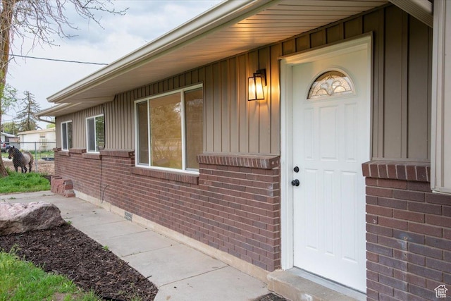 2389 S 4300 W, Taylor, UT 84401 - property entrance with board and batten siding, brick siding, and fence