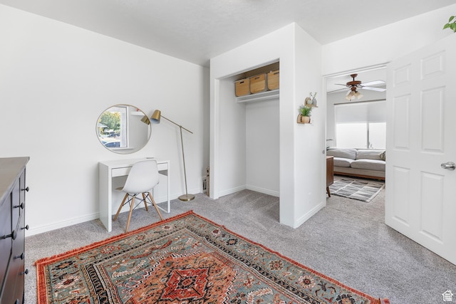 carpeted bedroom featuring baseboards