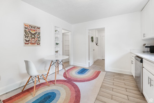 interior space with light wood-type flooring and baseboards
