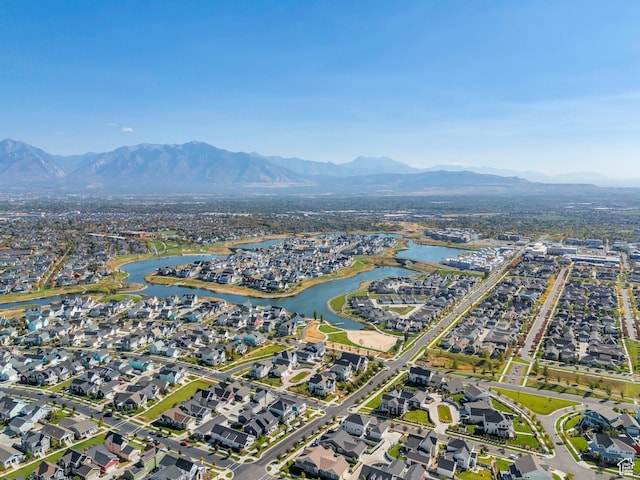 birds eye view of property with a water and mountain view and a residential view