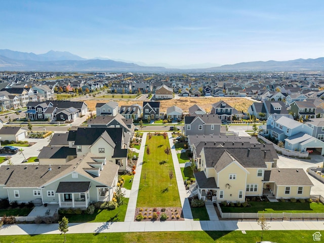 drone / aerial view with a residential view and a mountain view