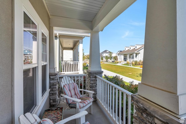 balcony with a residential view and covered porch