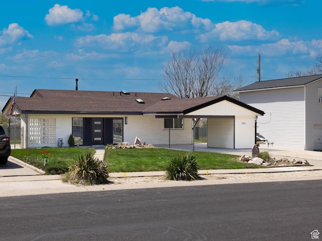 934 E Carnation Dr, Sandy, UT 84094 - ranch-style house featuring a front lawn, an attached carport, and brick siding