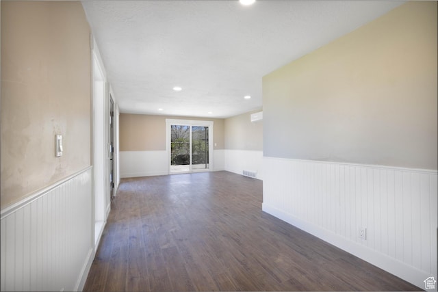 934 E Carnation Dr, Sandy, UT 84094 - empty room featuring recessed lighting, wood finished floors, visible vents, and a wainscoted wall