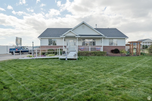 4577 S 4300 W, West Haven, UT 84401 - view of front of property featuring fence, covered porch, brick siding, and a front yard