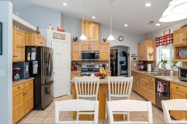 4577 S 4300 W, West Haven, UT 84401 - kitchen featuring stainless steel appliances, a sink, light tile patterned flooring, backsplash, and lofted ceiling