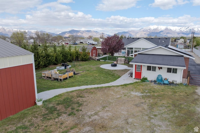 4577 S 4300 W, West Haven, UT 84401 - view of yard featuring a fire pit, an outbuilding, a storage shed, and a mountain view