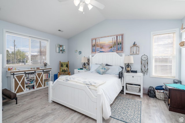 4577 S 4300 W, West Haven, UT 84401 - bedroom with multiple windows, vaulted ceiling, visible vents, and wood finished floors