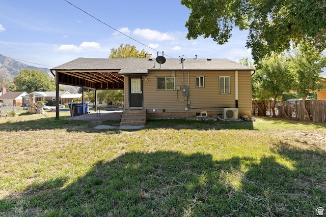 630 E 2550 N, North Ogden, UT 84414 - rear view of house featuring a fenced backyard, ac unit, and a yard