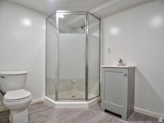 630 E 2550 N, North Ogden, UT 84414 - bathroom featuring baseboards, wood finished floors, a shower stall, and toilet