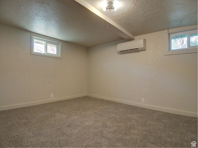 630 E 2550 N, North Ogden, UT 84414 - basement with a textured ceiling, a wall mounted AC, a wealth of natural light, carpet, and baseboards