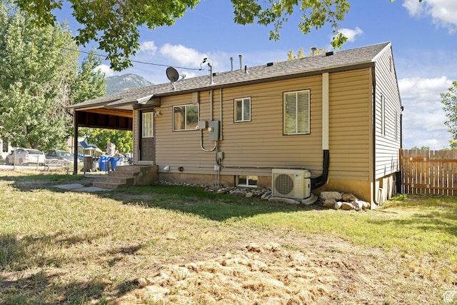 630 E 2550 N, North Ogden, UT 84414 - rear view of property featuring fence, ac unit, and a yard