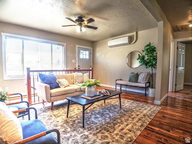 630 E 2550 N, North Ogden, UT 84414 - living area featuring an AC wall unit, a ceiling fan, wood finished floors, a textured ceiling, and baseboards