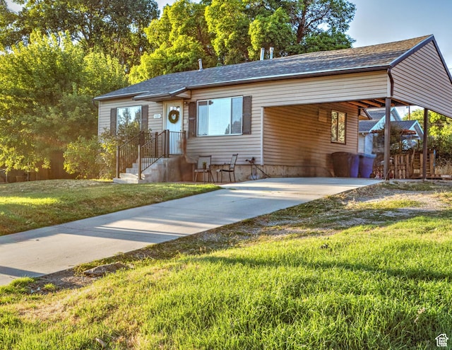 ranch-style home with a carport and a front yard