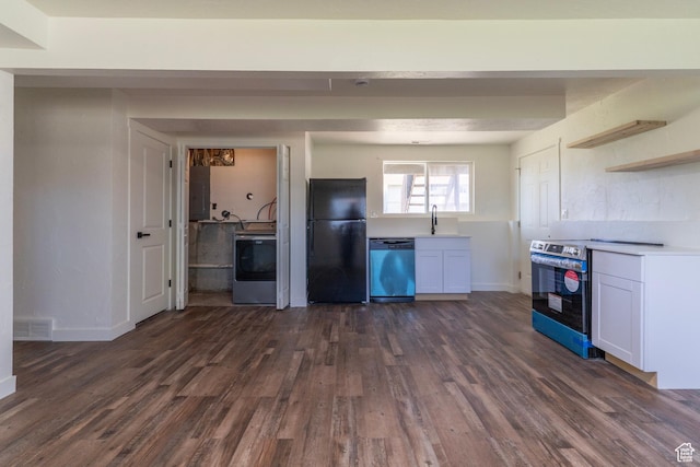 kitchen with stainless steel appliances, open shelves, washer / dryer, dark wood-style floors, and visible vents