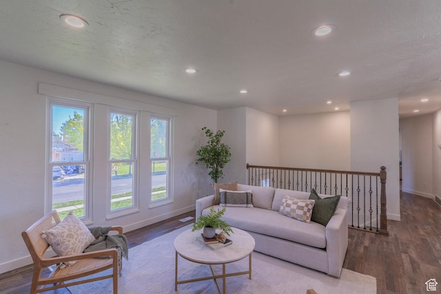 living room with recessed lighting, wood finished floors, and baseboards