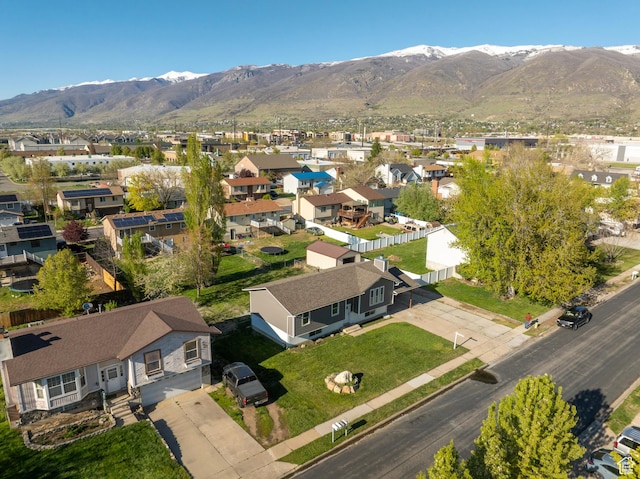 birds eye view of property with a mountain view and a residential view