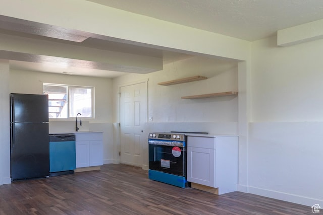 kitchen with dark wood-style flooring, a sink, stainless steel range with electric cooktop, dishwasher, and freestanding refrigerator