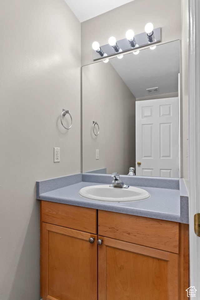 bathroom with vanity and visible vents