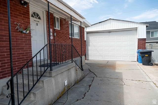 3724 S Carolyn St, Millcreek, UT 84106 - entrance to property featuring concrete driveway and brick siding